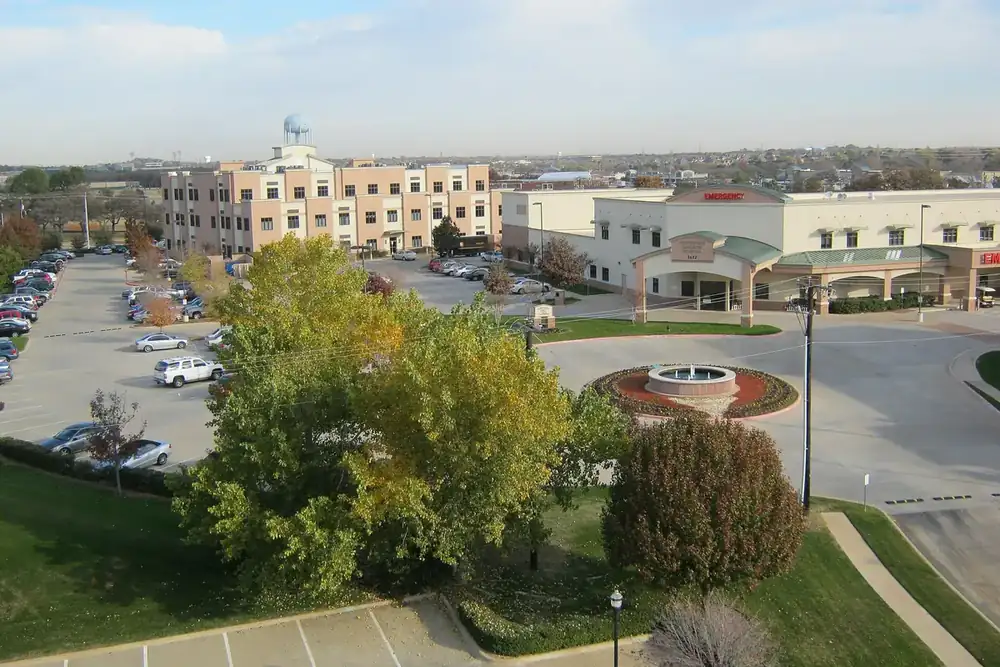 Aerial view of Hurst Town Center with office buildings and a water tower in Hurst, Texas